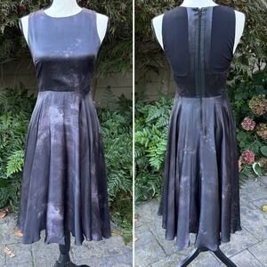 Alice + Olivia Black Sleeveless
Silk High Low Galaxy Midi Dress
Measures Size XS